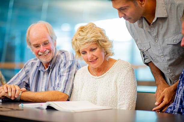 istock Group of Diverse Adults Learning Together in an Educational Setting 2226370931