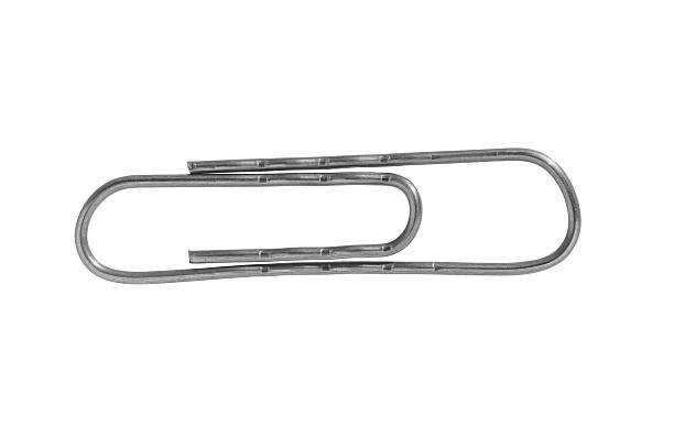 Close-up of a single, shiny, metallic paperclip isolated on a white background, ready for use in an office setting