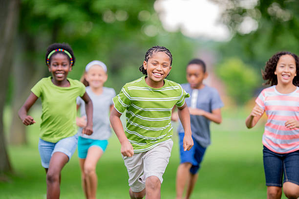 istock Group of Happy Children Running Outdoors and Having Fun Together 2226373686