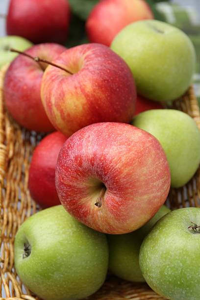 istock Fresh ripe apples in wicker basket, closeup 2226376848