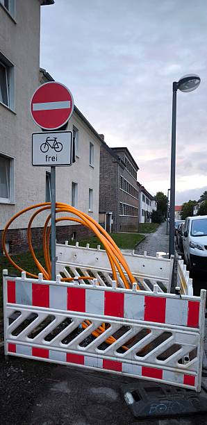 istock Road works: fiber optic cable to be laid and a road sign prohibiting passage 2226377475
