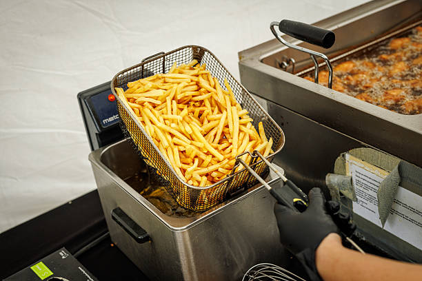 istock French fries being removed from deep fryer 2226377599