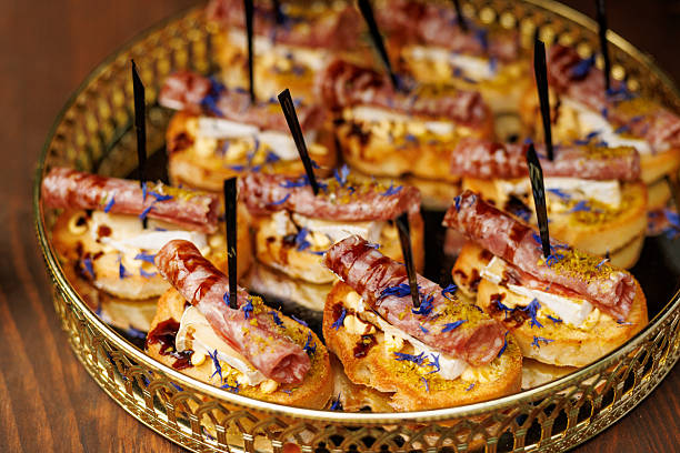 Tray of canapes with salami and cheese on skewers