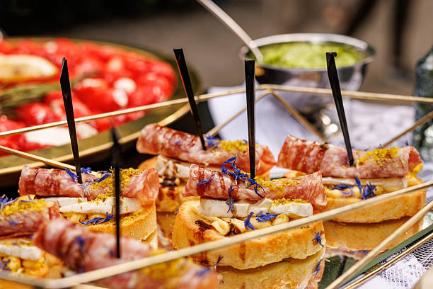 Appetizer skewers with cheese, herbs and salami