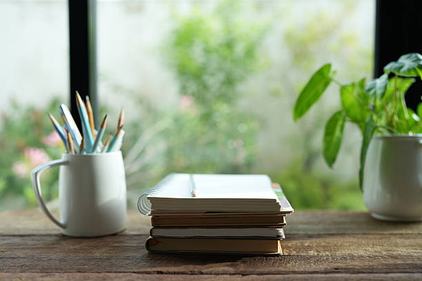 istock notebooks and pencils on wood table 2226382368