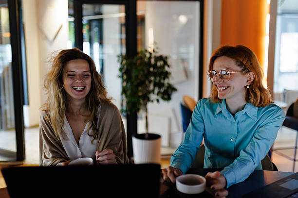 istock Businesswomen in a modern workspace discussing ideas while enjoying coffee during the afternoon 2226383490