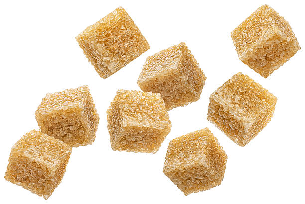 istock Cubes of cane sugar isolated on white background 2226383866