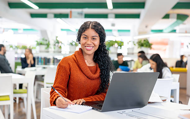 istock Happy university student smiling at the library 2226385932