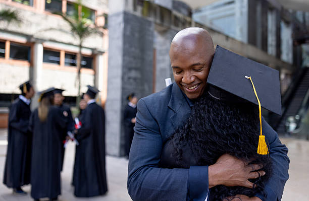 istock Loving father congratulating his daughter on her graduation and hugging her 2226386413