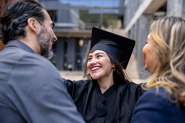 istock Happy graduate student hugging her parents after getting her diploma 2226386415