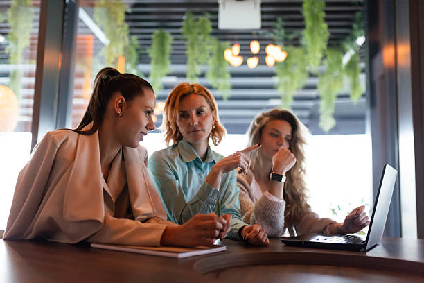 istock Businesswomen collaborate during a productive meeting in a modern office space with greenery 2226387032