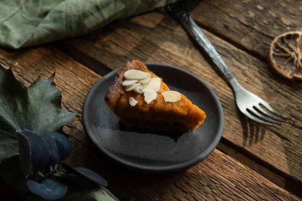 istock Slice of pumpkin pie sprinkled with sliced almonds 2226393467