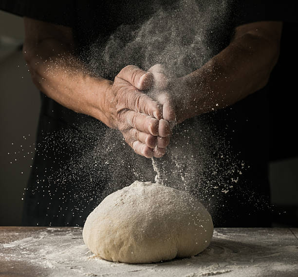 istock Elderly Hands Kneading Dough for Homemade Bread 2226400068