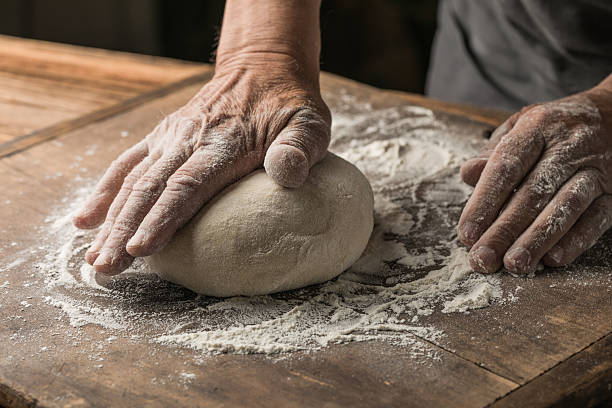 istock Elderly Hands Kneading Dough for Homemade Bread 2226400071