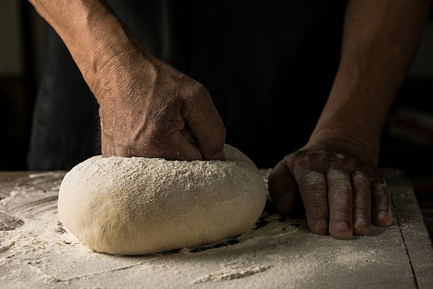 istock Elderly Hands Kneading Dough for Homemade Bread 2226400076