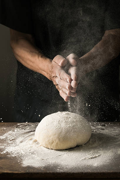 istock Elderly Hands Kneading Dough for Homemade Bread 2226400081
