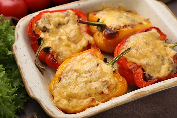 istock Delicious stuffed peppers in baking dish on brown table, closeup 2226404090
