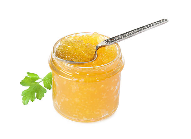 istock Fresh pike caviar in glass jar and spoon isolated on white 2226404191
