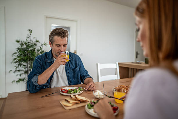 istock Couple enjoying a healthy breakfast at home 2226404398