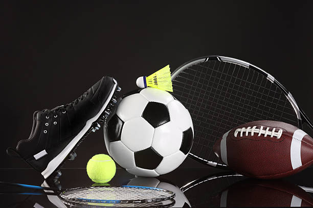 istock Many different sports equipment on black mirror surface 2226405261