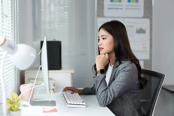 istock Young businesswoman working on computer in modern office 2226414772
