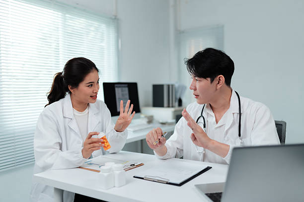 istock Two Doctors Discussing About Pills in Medical Office 2226415009