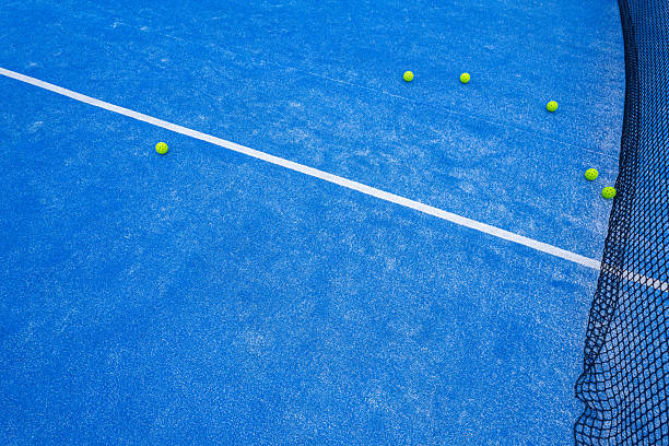 Aerial View of a Blue Court with a Net and Balls. Concept The strategy and geometry of court sports.