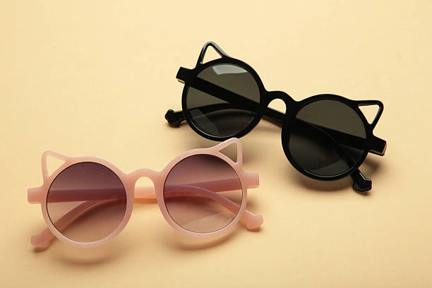 istock Kids sunglasses on beige background. Sun protection 2226416629
