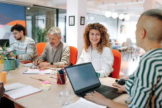 istock Group of colleagues working together in a modern boardroom 2226416700