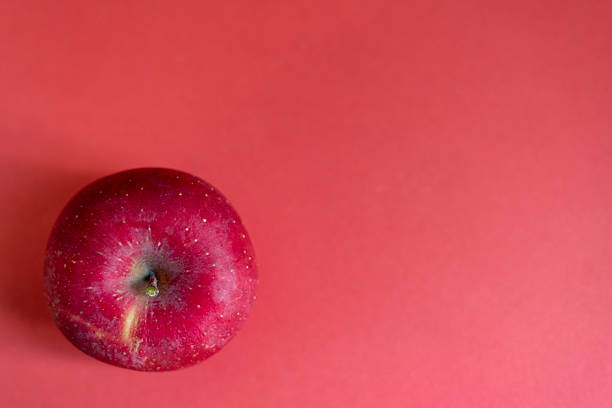 Delicious apples on a red background