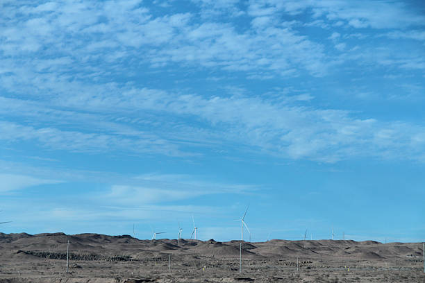 Wind turbines and Gobi scenery along the highway in a sunny day, Gansu Province of China