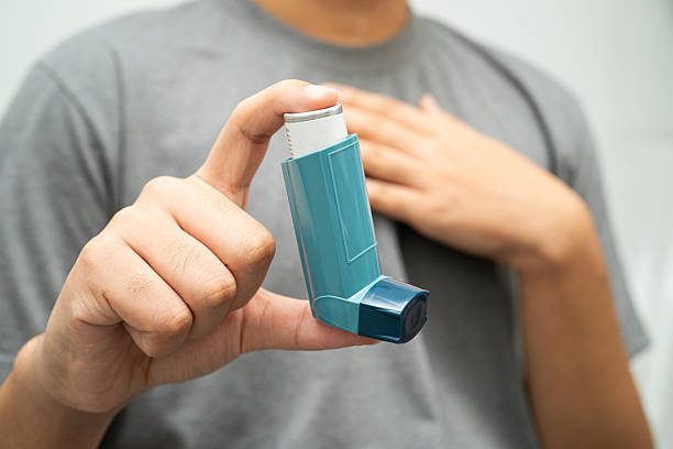 istock Asthma and chronic obstructive pulmonary disease COPD, Asian young man using metered dose inhaler MDI. 2226424277