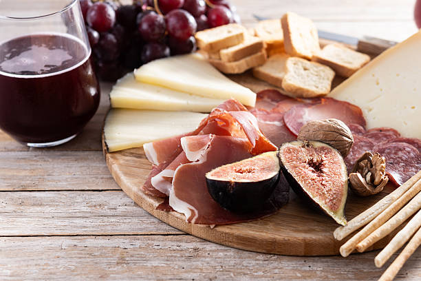 istock Charcuterie Board with Cheese, Grapes, and Figs 2226427217