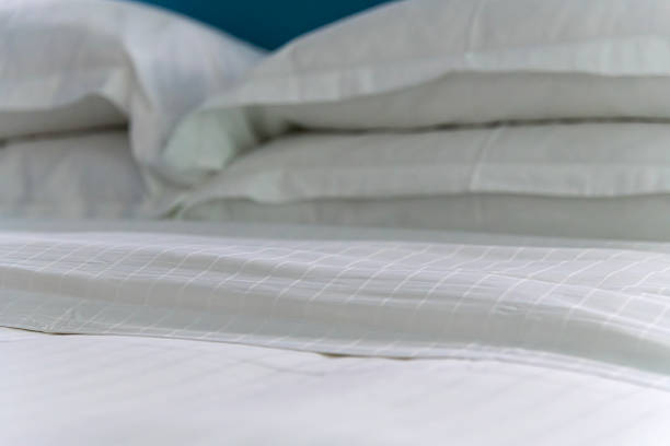 istock pillow on the bed at the hotel room 2226428390