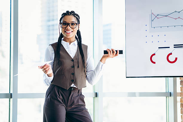 istock Professional businesswoman presenting analytics data at a corporate meeting in a modern office environment 2226433588