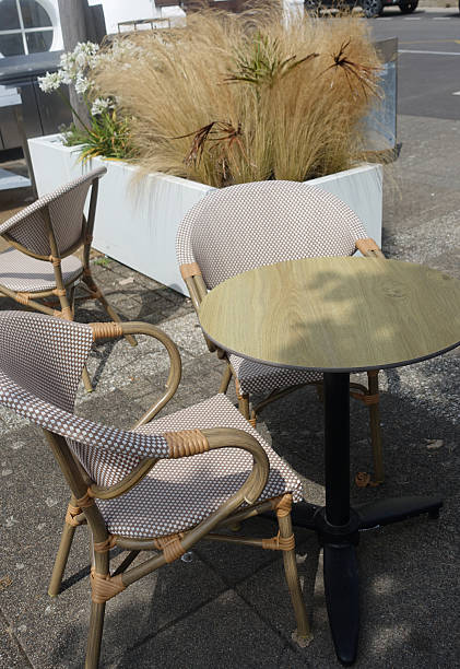 istock Chairs and table on a sidewalk in a public place 2226436284