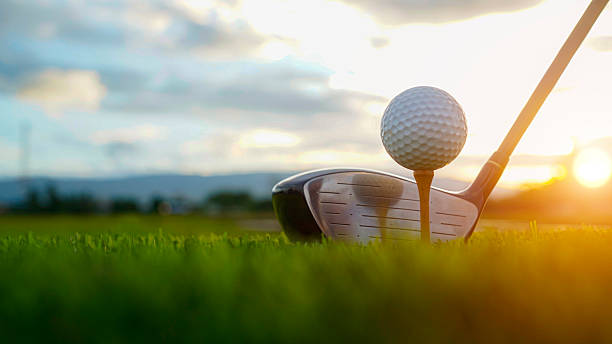 istock Golf Ball on Tee and Club Ready for Swing at Sunset 2226436625