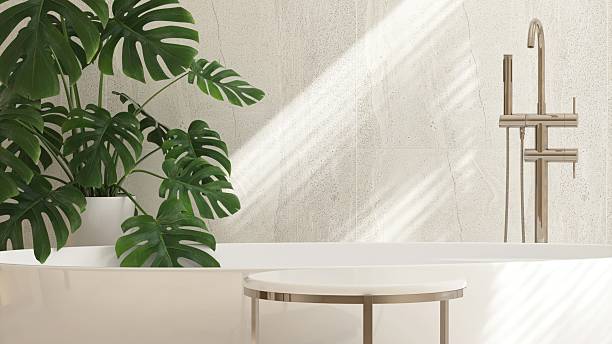 istock Minimal marble side table by white, cream freestanding bathtub in modern, elegant bathroom, sunlight on tiled wall with tropical monstera tree for luxury fashion, beauty, cosmetic, skincare, body care product display background 3D 2226438021