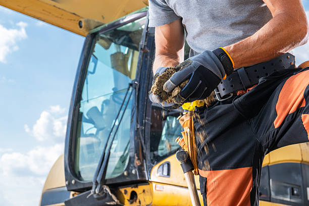 istock Construction Worker Examining Soil Quality at a Job Site During Midday Hours 2226440232