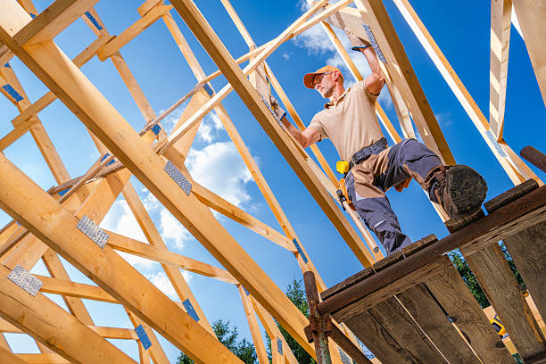 istock Skilled Carpenter Works on Roof Frame During Sunny Afternoon at Construction Site 2226440546