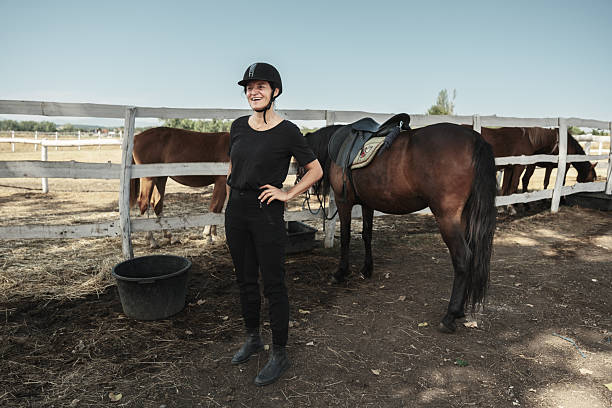 istock Mature woman getting ready for a horse ride 2226440874