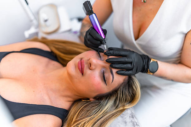 istock Beautician applying permanent eyeliner makeup on client 2226442955