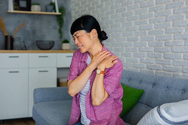 istock Woman Suffering from Shoulder Pain at Home 2226446583