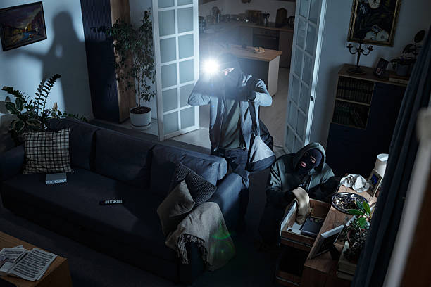 istock Two Men Wearing Masks Stealing Valuables during Home Burglary 2226450275