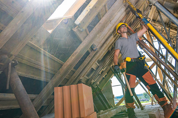 istock Construction Worker Lifting Materials During a Sunny Day at a Building Site 2226450834