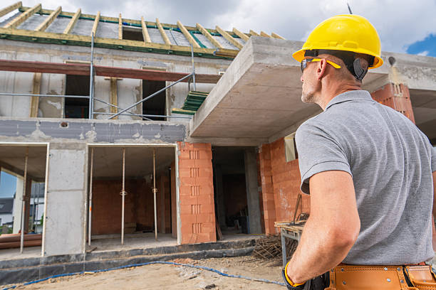 istock Construction Worker Observes Progress of New Building in Urban Area With Scaffolding 2226451213
