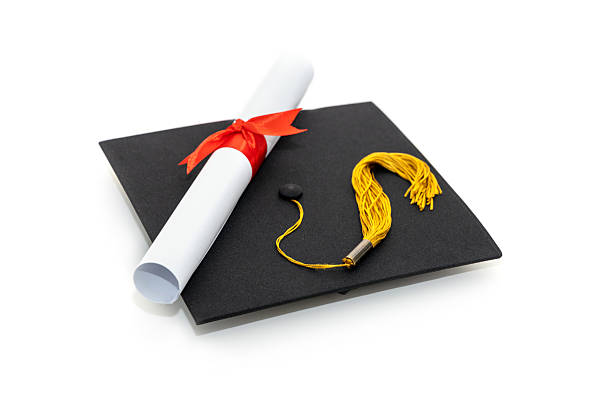 istock Graduation hat and diploma, isolated on white background. 2226451887