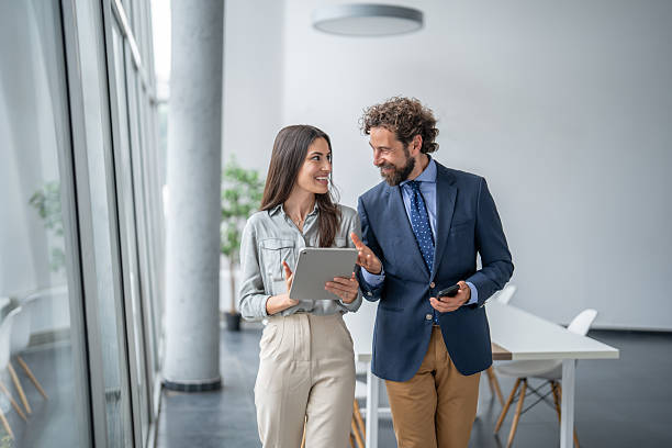 istock Businesspeople walking and talking in modern office 2226454182