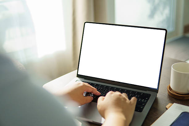 istock Hands typing on laptop with blank screen. Concept of communication, or design mockup. 2226455165