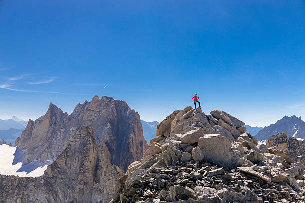 Chamonix, France - 8 August 2024: Climbers ascending Mont Blanc in daylight alpine landscape snowy mountain ridge outdoor adventure high altitude glacier mountaineering gear highest European peak scenery